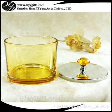 yellow colored candle tumbler jars with decorative metal lid withe holes